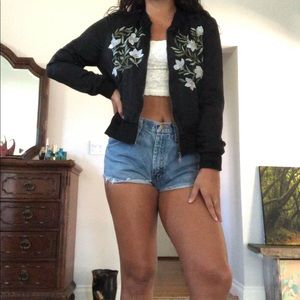 Black bomber jacket with pretty light blue flowers